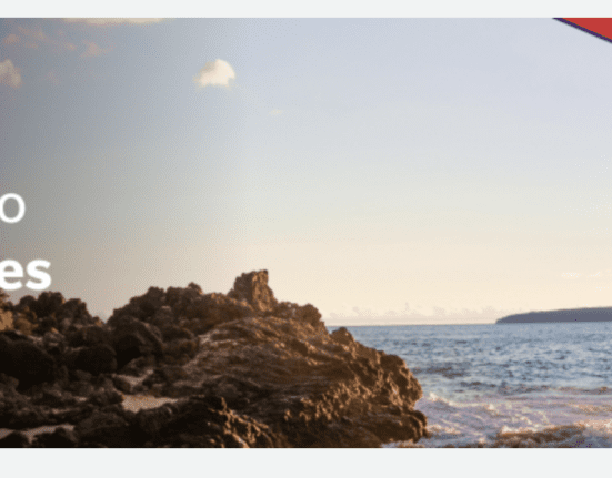 a rocky beach with waves crashing on it